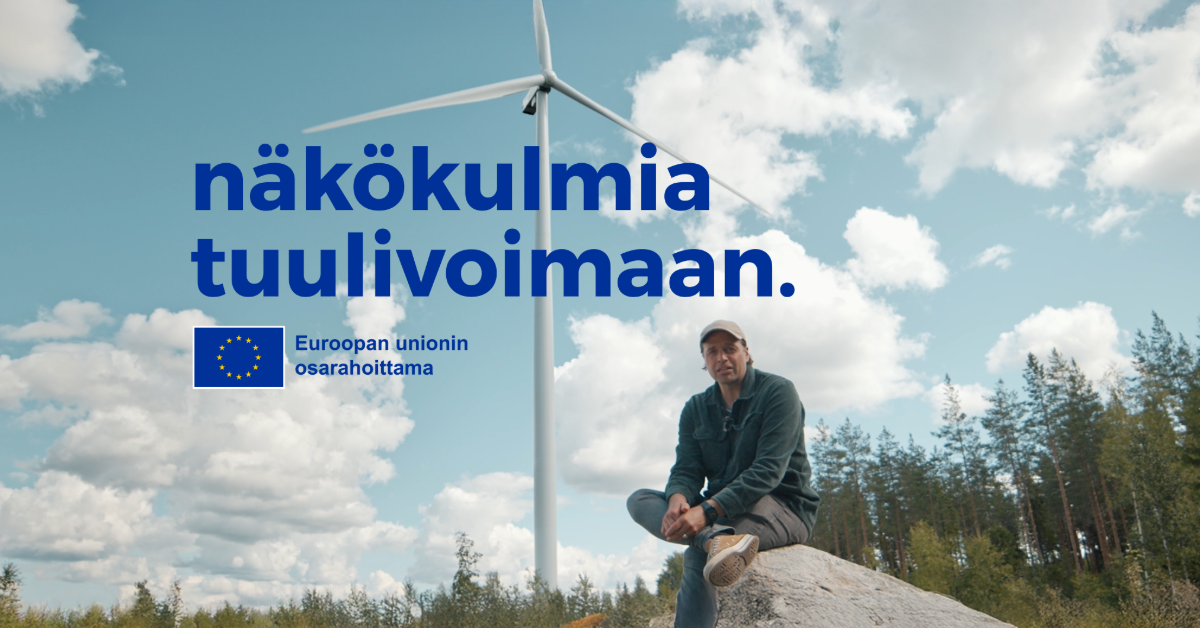 Kuvassa Kimmo Ohtonen ja tuulivoimala.